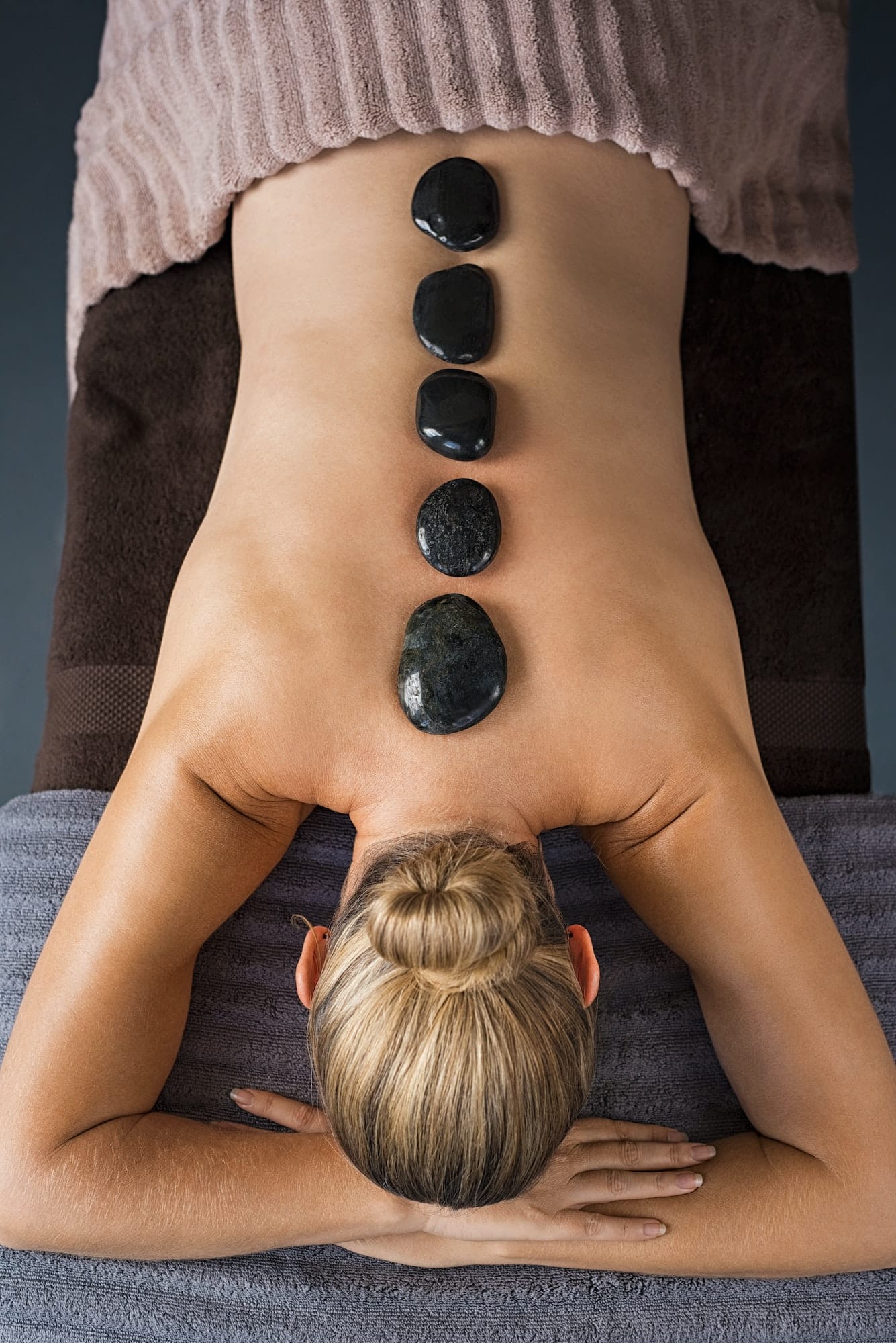 Hot stone massage at maahru massage center in DHA karachi